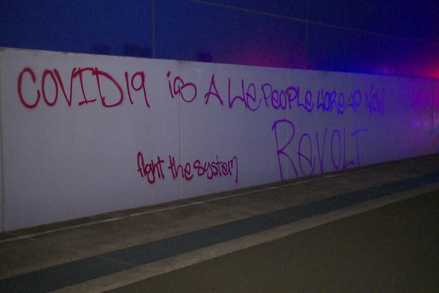 Click to enlarge nsw covid testing centre fire graffiti