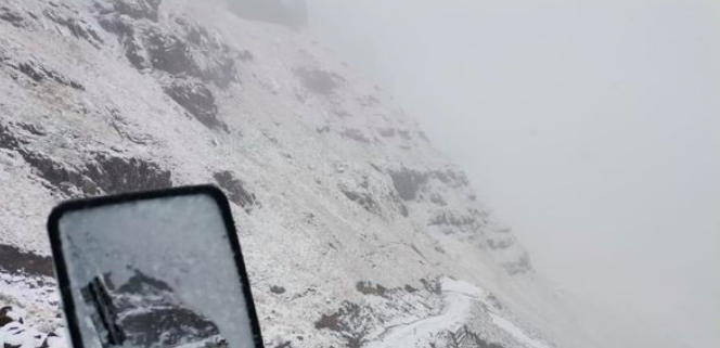 Click to enlarge Snow on Sani Pass.