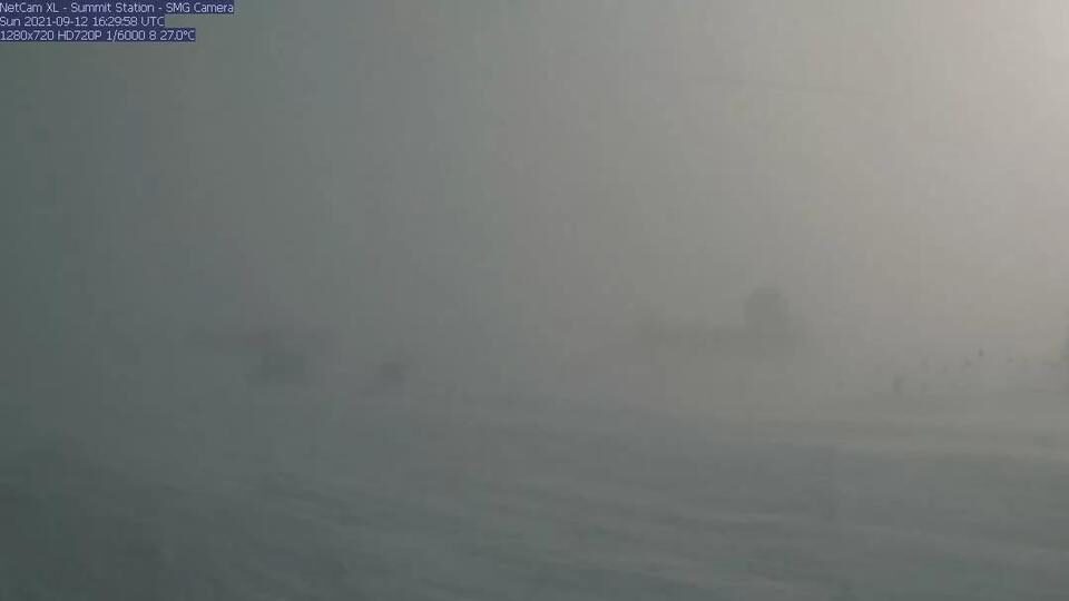 A webcam still showing blizzard conditions at Summit Station, a weather research station at Greenland's highest point.