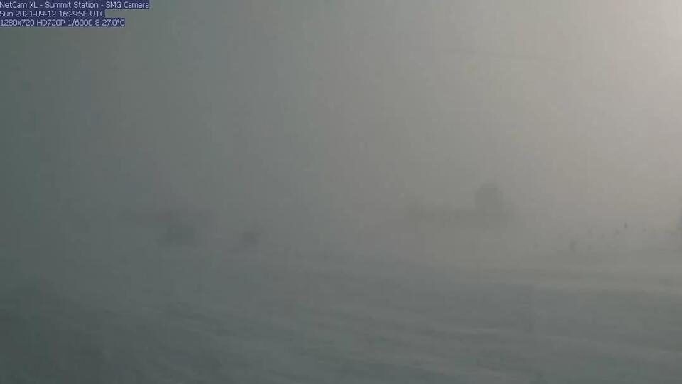 A webcam still showing blizzard conditions at Summit Station, a weather research station at Greenland's highest point.