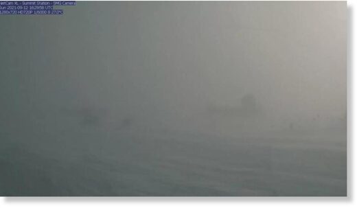 A webcam still showing blizzard conditions at Summit Station, a weather research station at Greenland's highest point.
