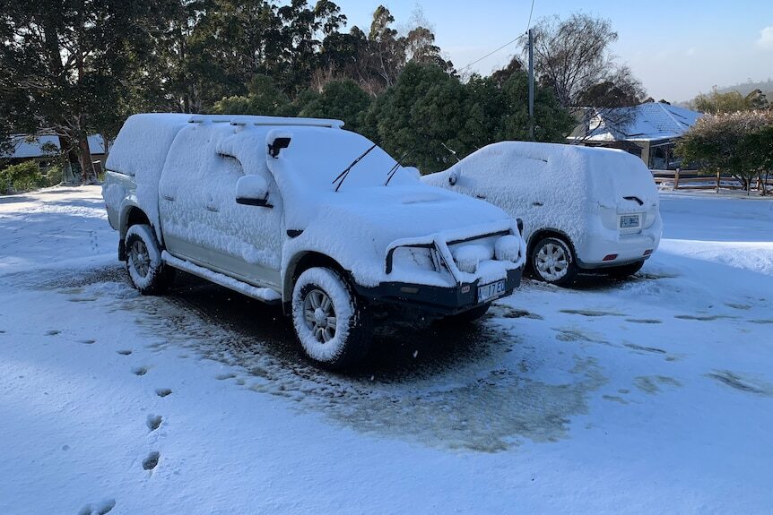 Click to enlarge Fern Tree residents woke to find cars blanketed in snow.
