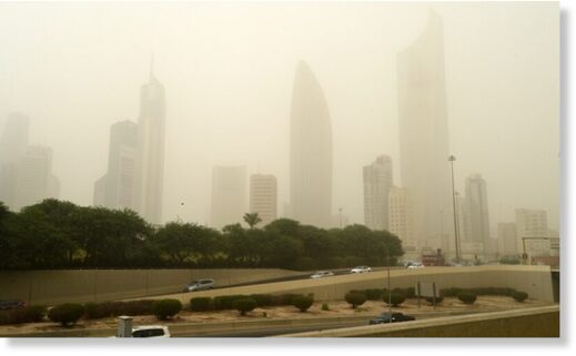 Photo taken on Sept. 26, 2021 shows buildings shrouded in heavy dust in Kuwait City, Kuwait. A heavy sand storm engulfed Kuwait on Sunday.