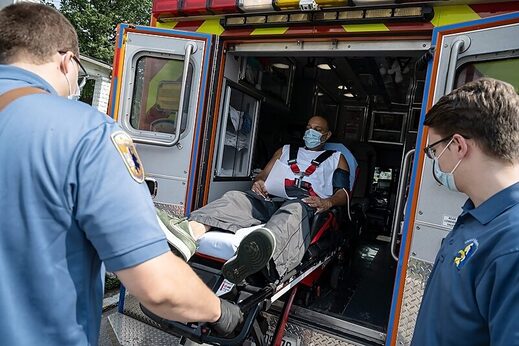 Click to enlarge man ambulance covid