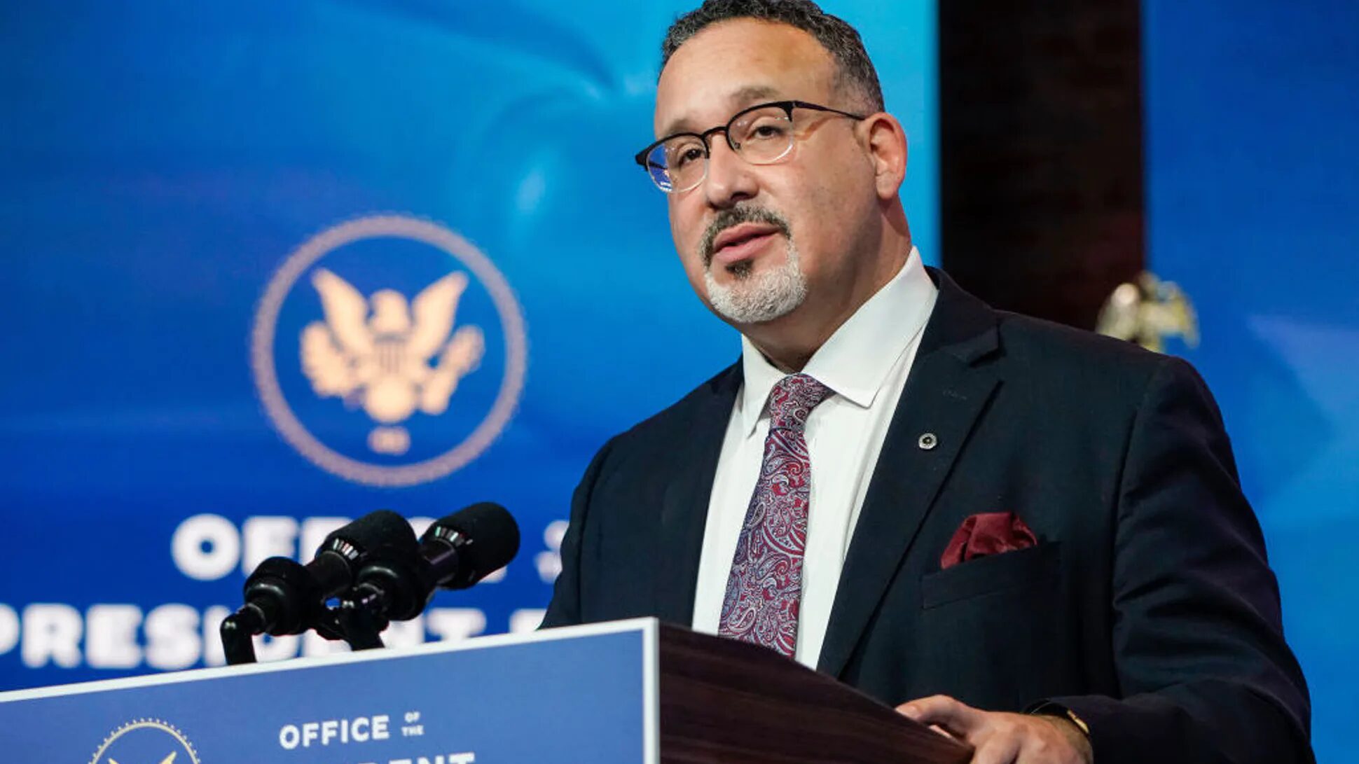 Click to enlarge Education Secretary Miguel Cardona