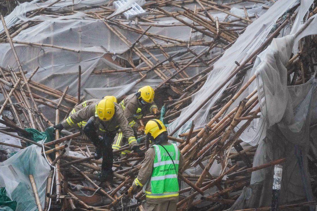 Firefighters search for people after scaffolding collapsed on Broadwood Road in Happy Valley.