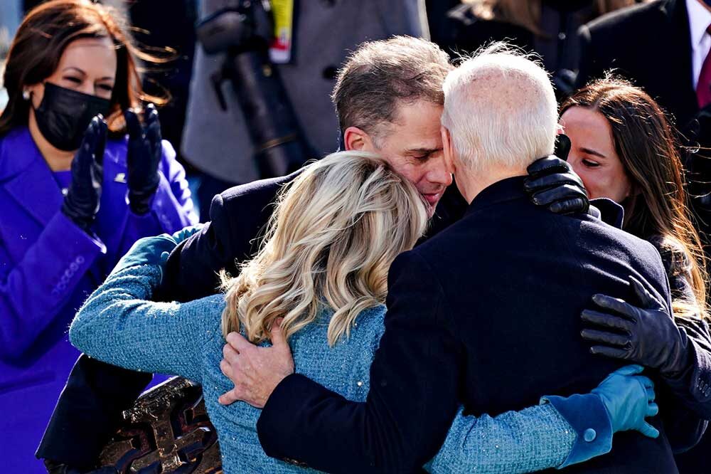 Click to enlarge Joe Biden embraces members of his family