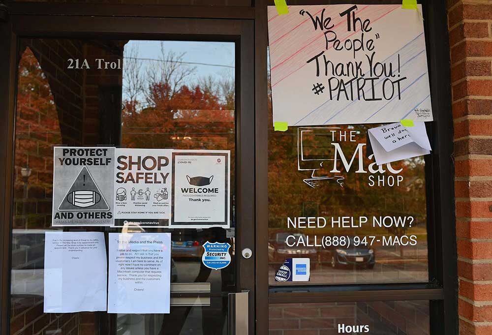 Click to enlarge Signs of support are posted outside