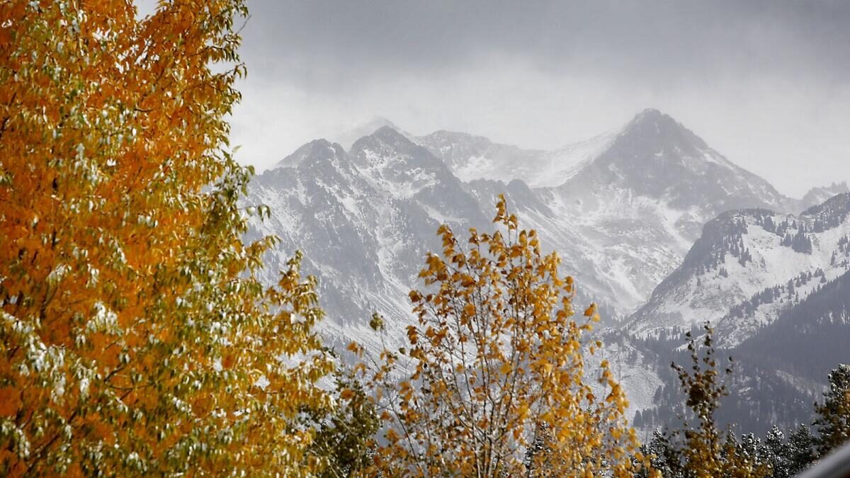 Clouds lift from the West Needles on Tuesday morning to reveal the snow-covered San Juan Mountains north of Durango.
