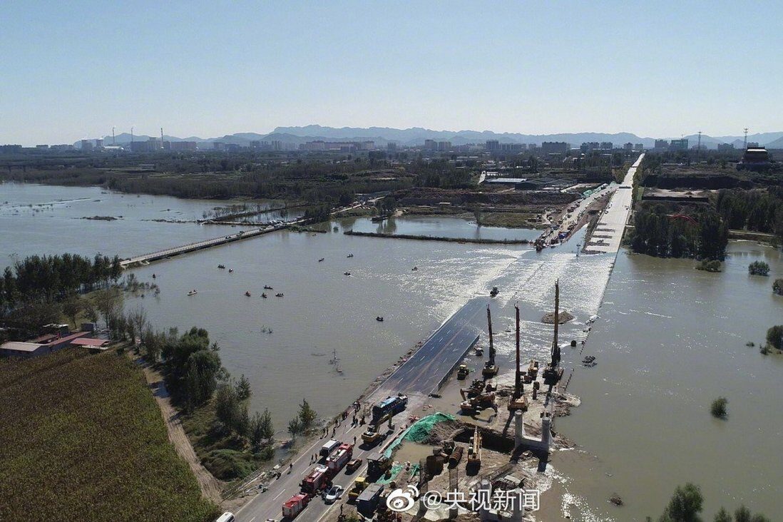 Click to enlarge A bus carrying 51 people veered off Wangmu Bridge and into the Hutuo River on Monday.