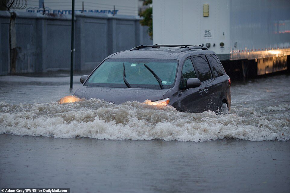 Click to enlarge One brave driver tried to brave the flood waters in Brooklyn on Tuesday morning