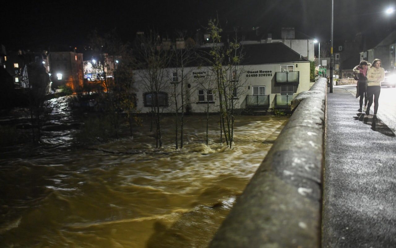 Click to enlarge Trees are submerged as the River Teviot burst