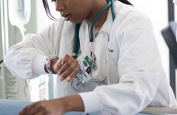 doctor takes pulse