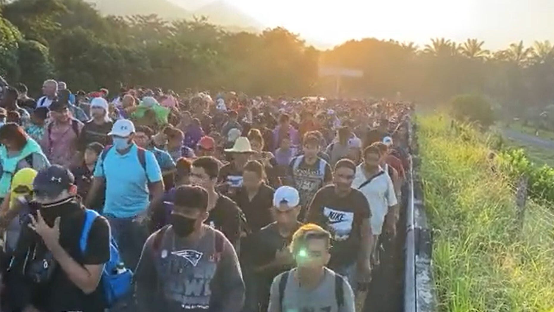 Click to enlarge Migrants make their way to the U.S. border.