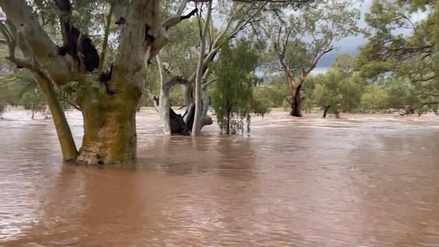 Usually Dry River Overflows During Record Rainfall in Alice Springs