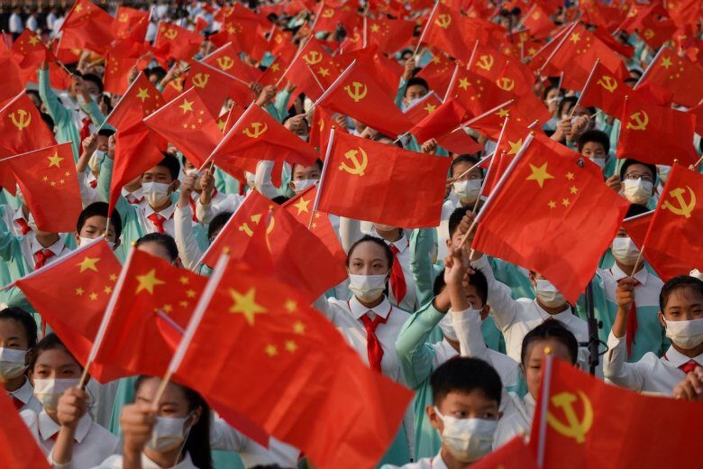 Students wave flags