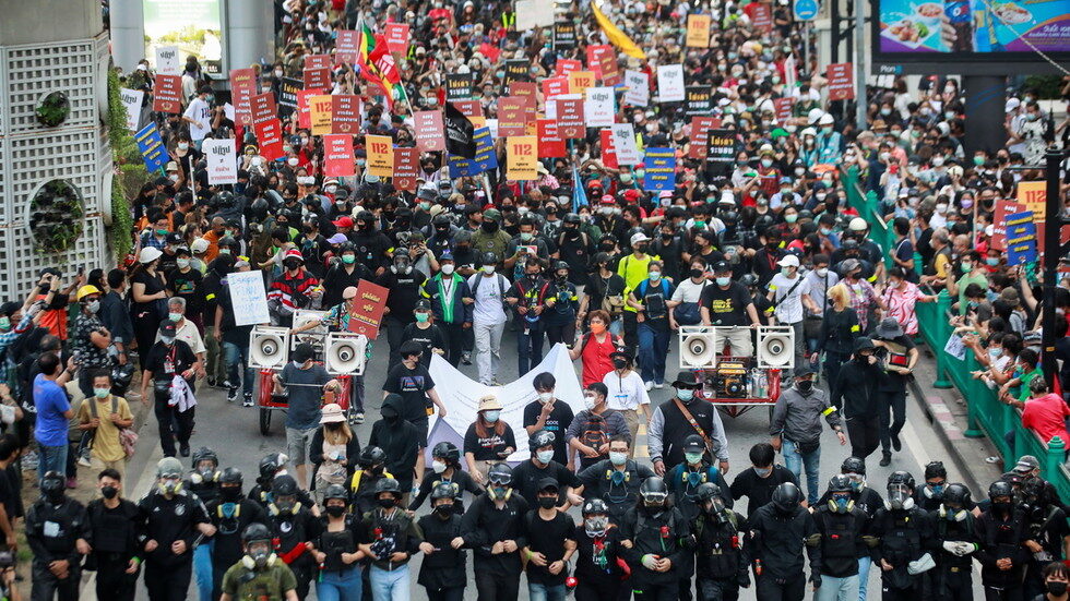 Demonstrators march in Bangkok, Thailand, on November 14, 2021.