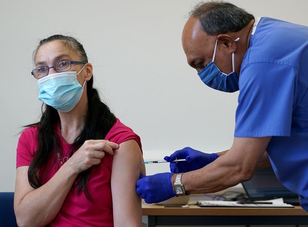 Click to enlarge vaccine, woman getting vaccine, vaccination