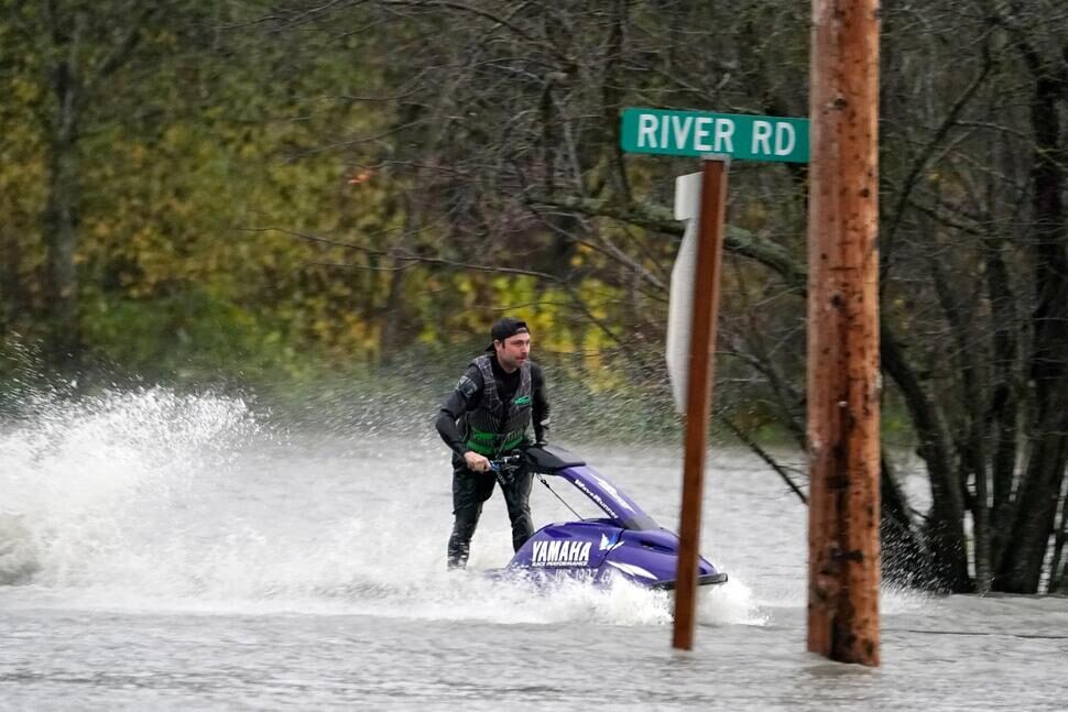 Click to enlarge A man operates a personal watercraft along