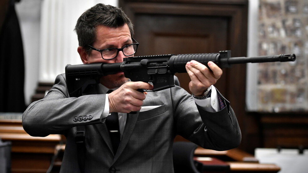 Click to enlarge thomas binger rittenhouse gun safety point at jurors