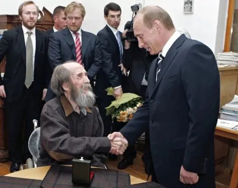 Click to enlarge Solzhenitsyn shakes hands with Putin in 2007.