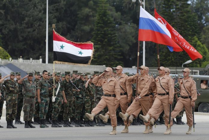 Click to enlarge Russian and Syrian soldiers