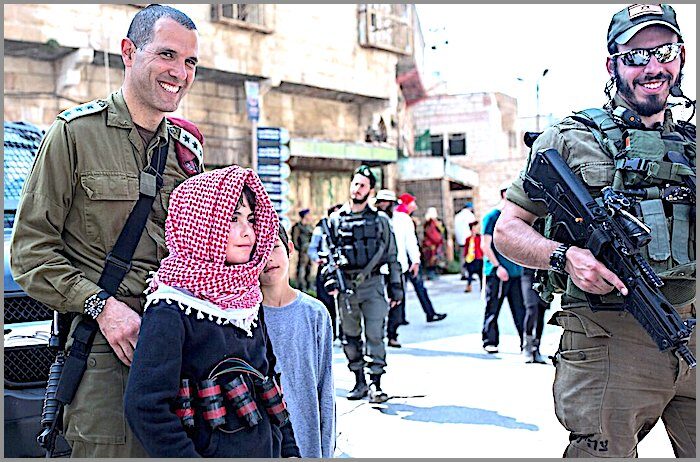 Click to enlarge Child and Israeli soldiers