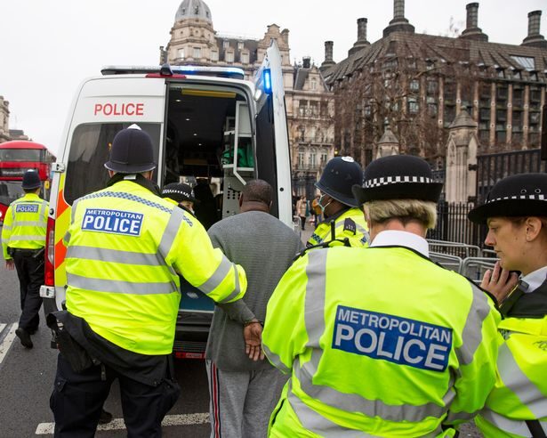 Click to enlarge parliament man police