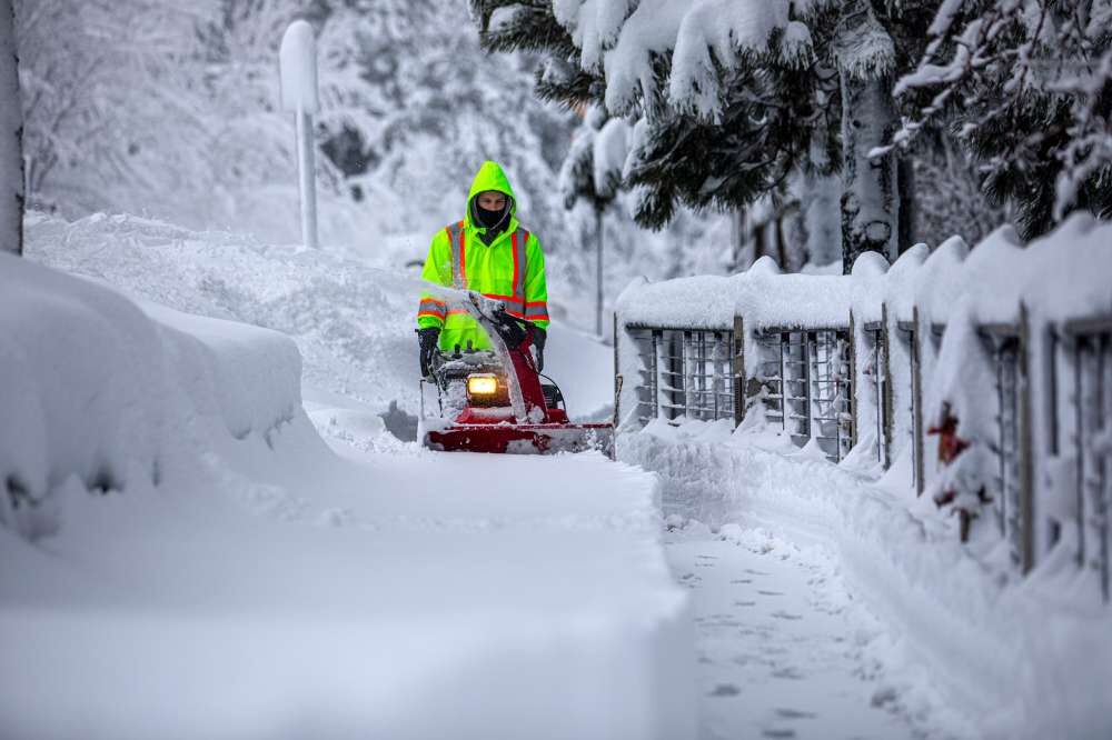Click to enlarge Local crews use snowblowers and plows to remove snow off the sidewalks in Tahoe City.
