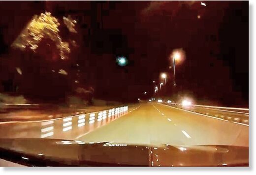 Click to enlarge A rare astronomical phenomenon of a blazing fireball streak in the sky was seen on Thursday night. Photo shows a dashcam footage of the flashing bright green light along Jalan Kebangsaan. -