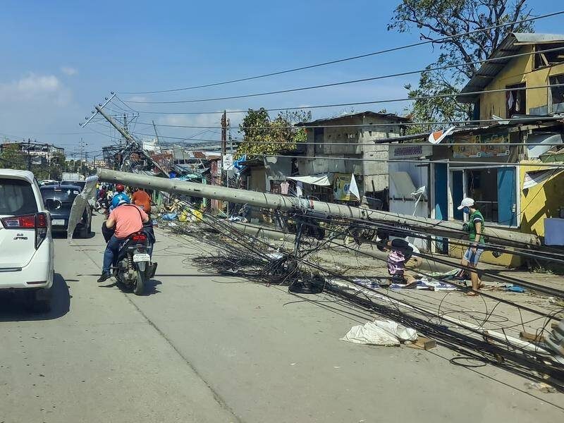 At least 142 people have been killed after Typhoon Rai battered the Philippines.