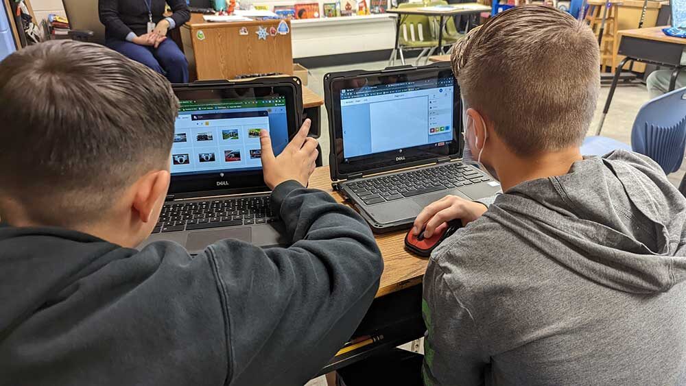Children in front of laptops