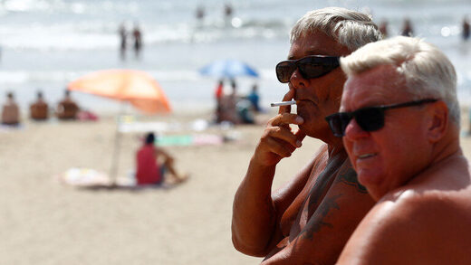 People smoking on beach
