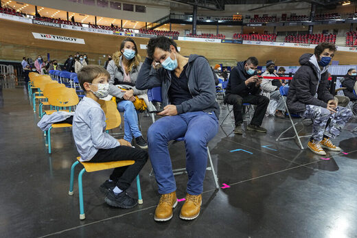 Click to enlarge waiting for vaccines
