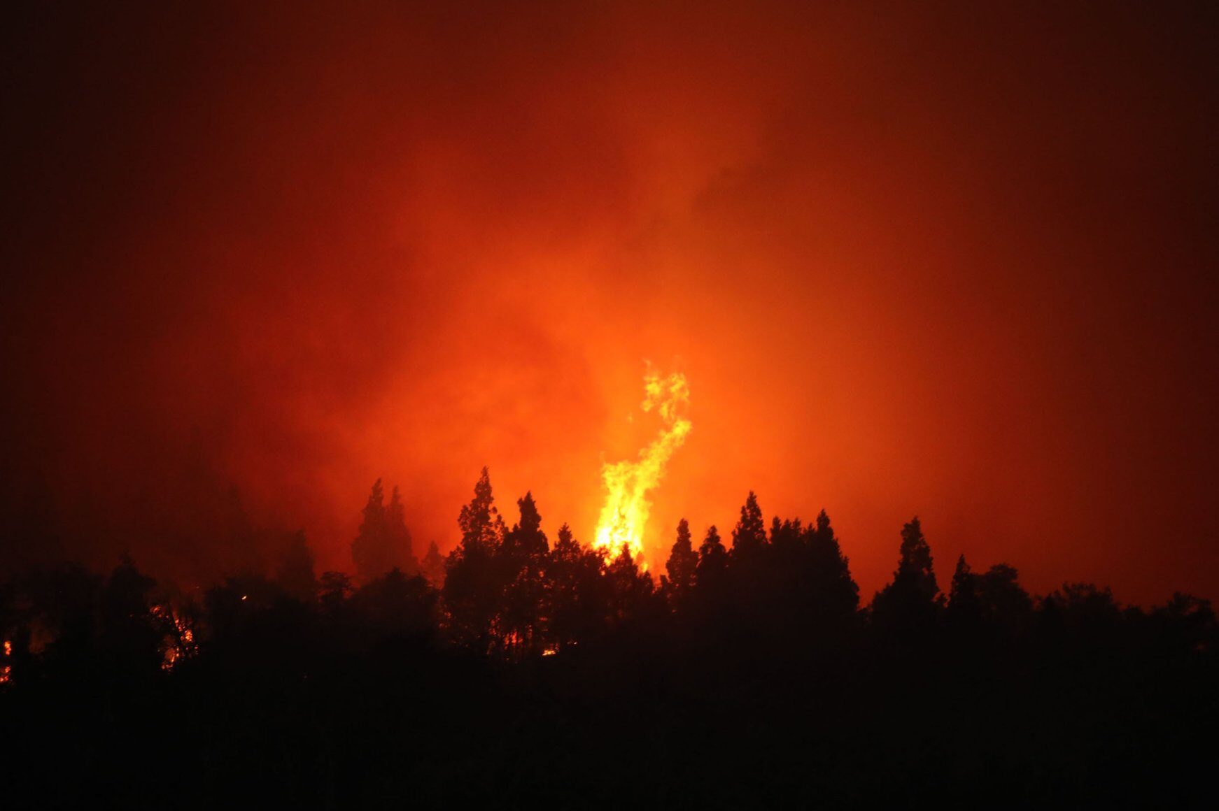 View of a huge fire in Paraje Villegas, Rio Negro province, 70 kilometers (43.5 miles) south of Bariloche, Argentina, Dec. 29, 2021.