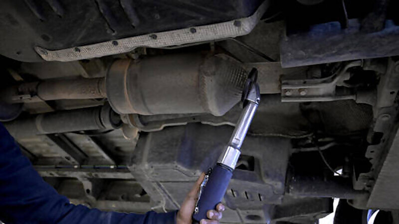 Click to enlarge catalytic coverter being installed
