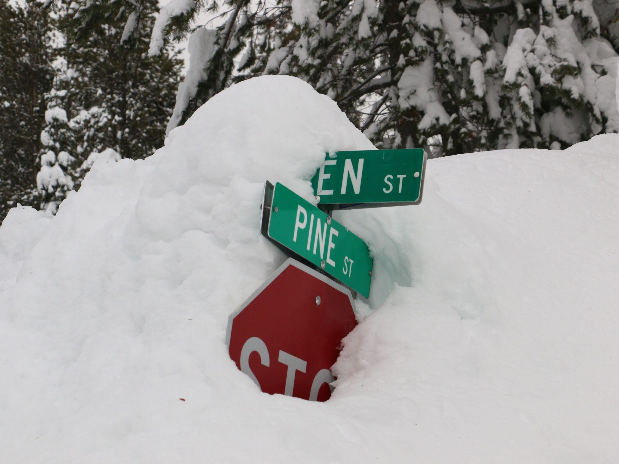 Deep snow from recent storms have partially buried the Donner Lake West End neighborhood just west of Truckee, as seen on Dec. 30, 2021.