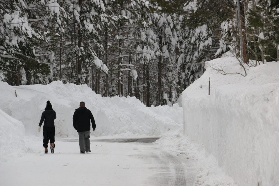 Deep snow from recent storms have partially buried the Donner Lake West End neighborhood just west of Truckee, as seen on Dec. 30, 2021.