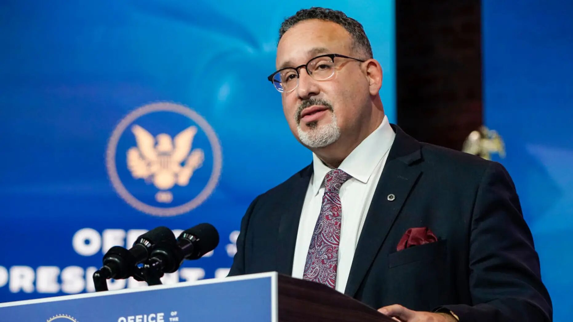 Click to enlarge Education Secretary Miguel Cardona