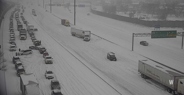 Click to enlarge A photo of cars stuck along Highway 401 west of Keele Street on Monday, Jan. 17, 2022.