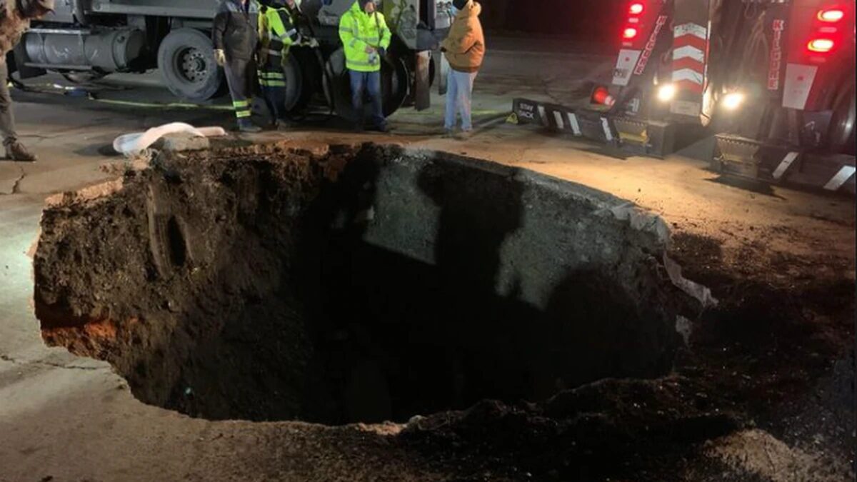 Dump truck falls into sinkhole in Birmingport