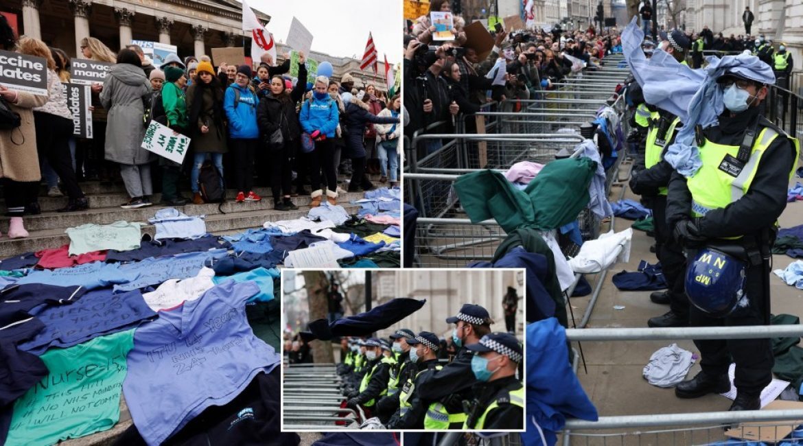 Click to enlarge NHS workers protest mandate uniforms