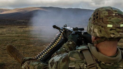US Army Lt. Col. Steven Templeton of the 4th Infantry Division, fires a machine gun