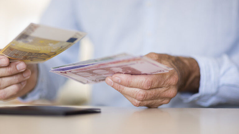 man counting money