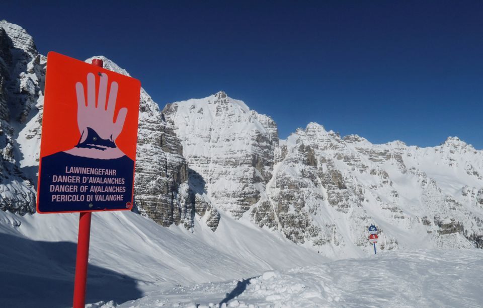 An avalanche warning sign is seen