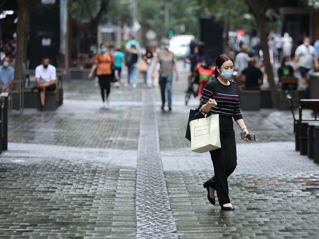 Click to enlarge Shoppers in Sydney’s Pitt Street Mall.