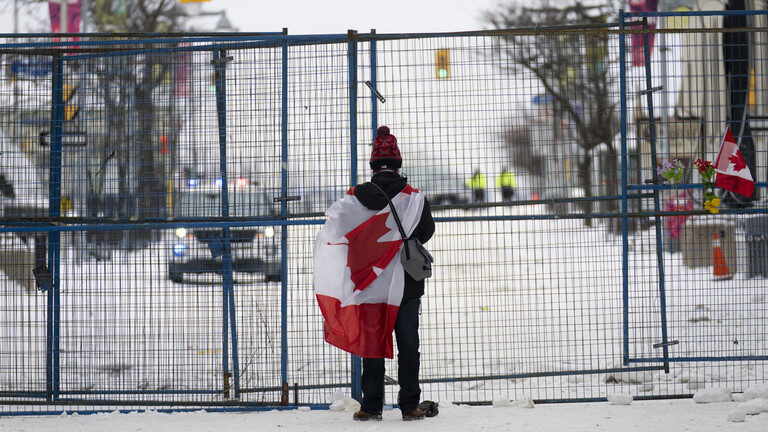 Click to enlarge lone canadian protester
