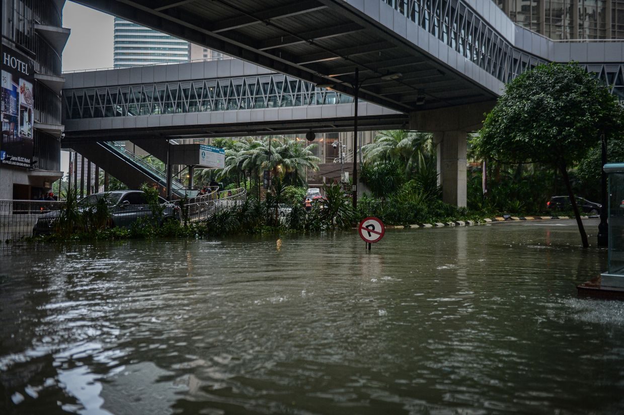 Under water: The area around Jalan Kia Peng near the Kuala Lumpur Convention Centre earlier on Monday (March 7).