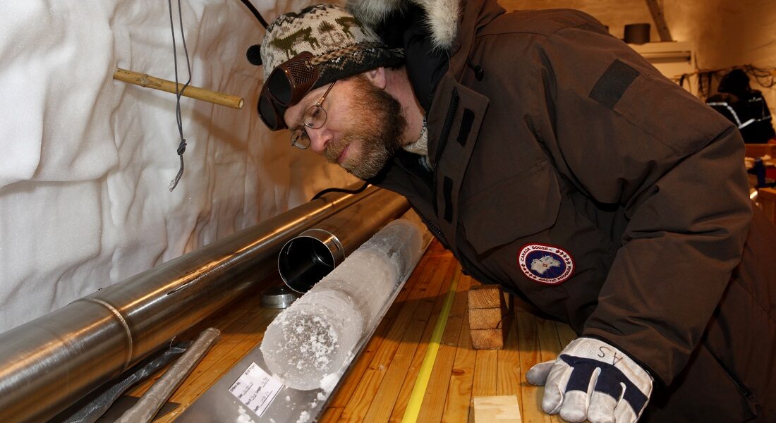 Click to enlarge Anders Svensson inspecting an icecore in Greenland