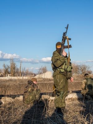 Click to enlarge Members of the Azov Brigade participate in weapons training